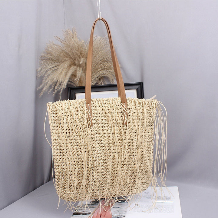 Handwoven beach bag made of natural materials with leather accents Kalsten