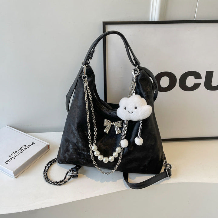 Fashionable handbag with unique pendant and chain accents Kalsten