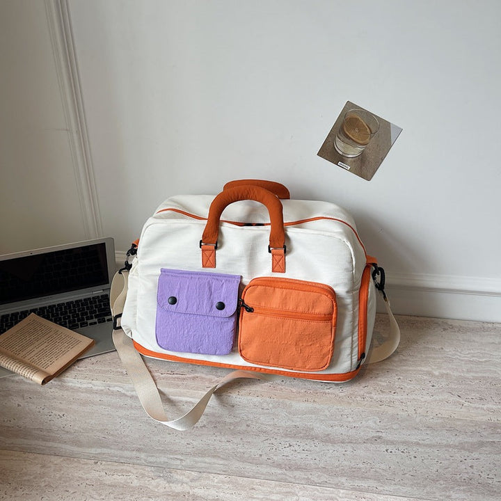 Sporty travel bag with multifunctional outer pockets Kalsten