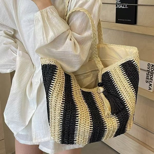 Handcrafted straw bag with elegant tassels and detailed texture Kalsten