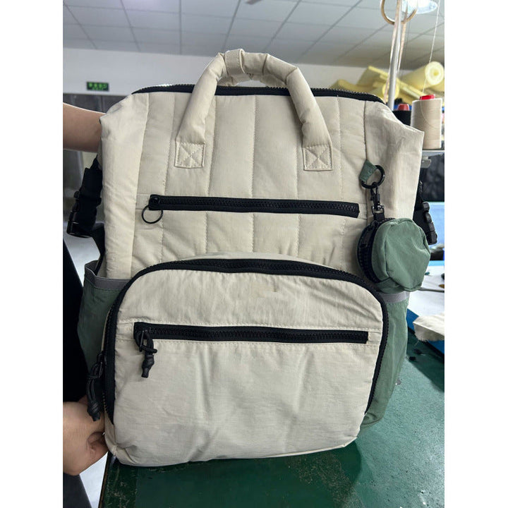 Multifunctional backpack with padded carrying handles and multiple compartments Kalsten