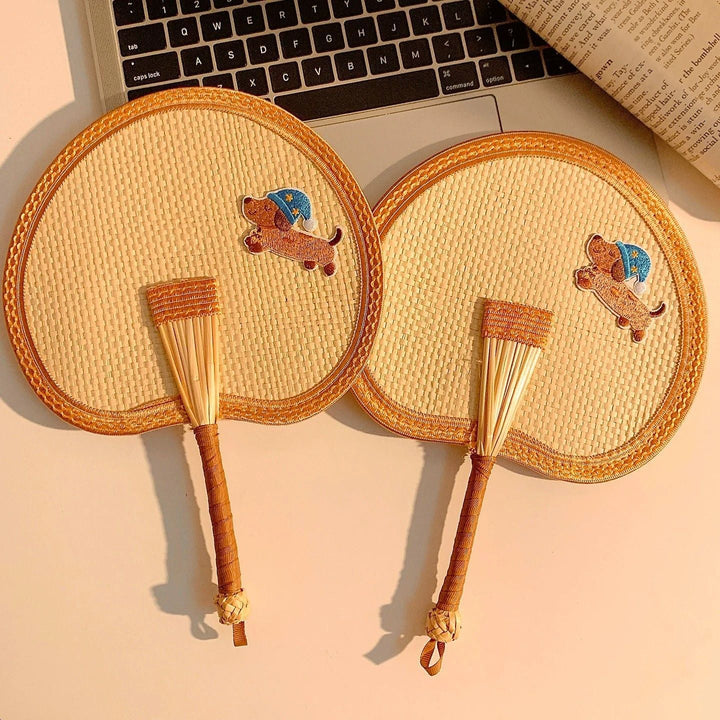Handcrafted fan with playful dog motif Kalsten