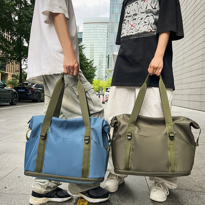 Sporty shoulder bag with water-repellent material and sturdy carrying handles Kalsten