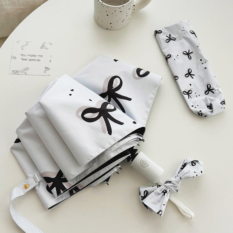 Women’s Folding Umbrella with Playful Bow Pattern Kalsten