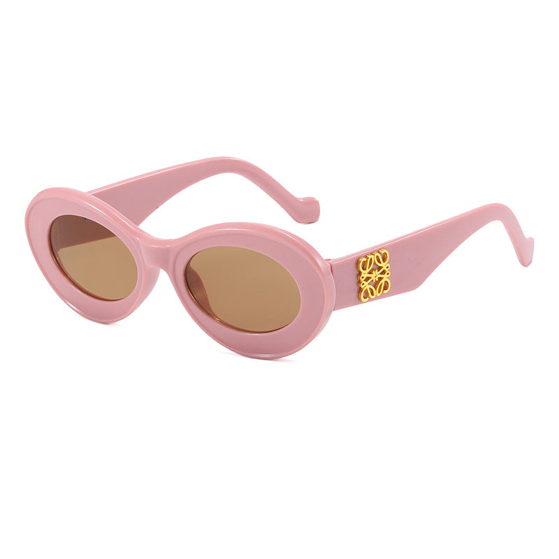 Women's fashionable sunglasses with oval frame and golden applications Kalsten