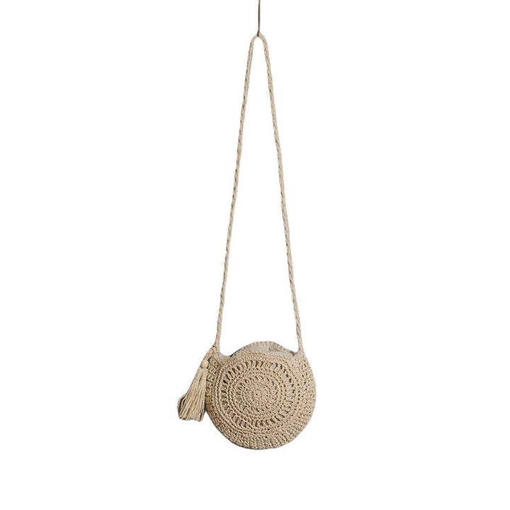Round bag made of natural jute material with trendy fringe detail Kalsten
