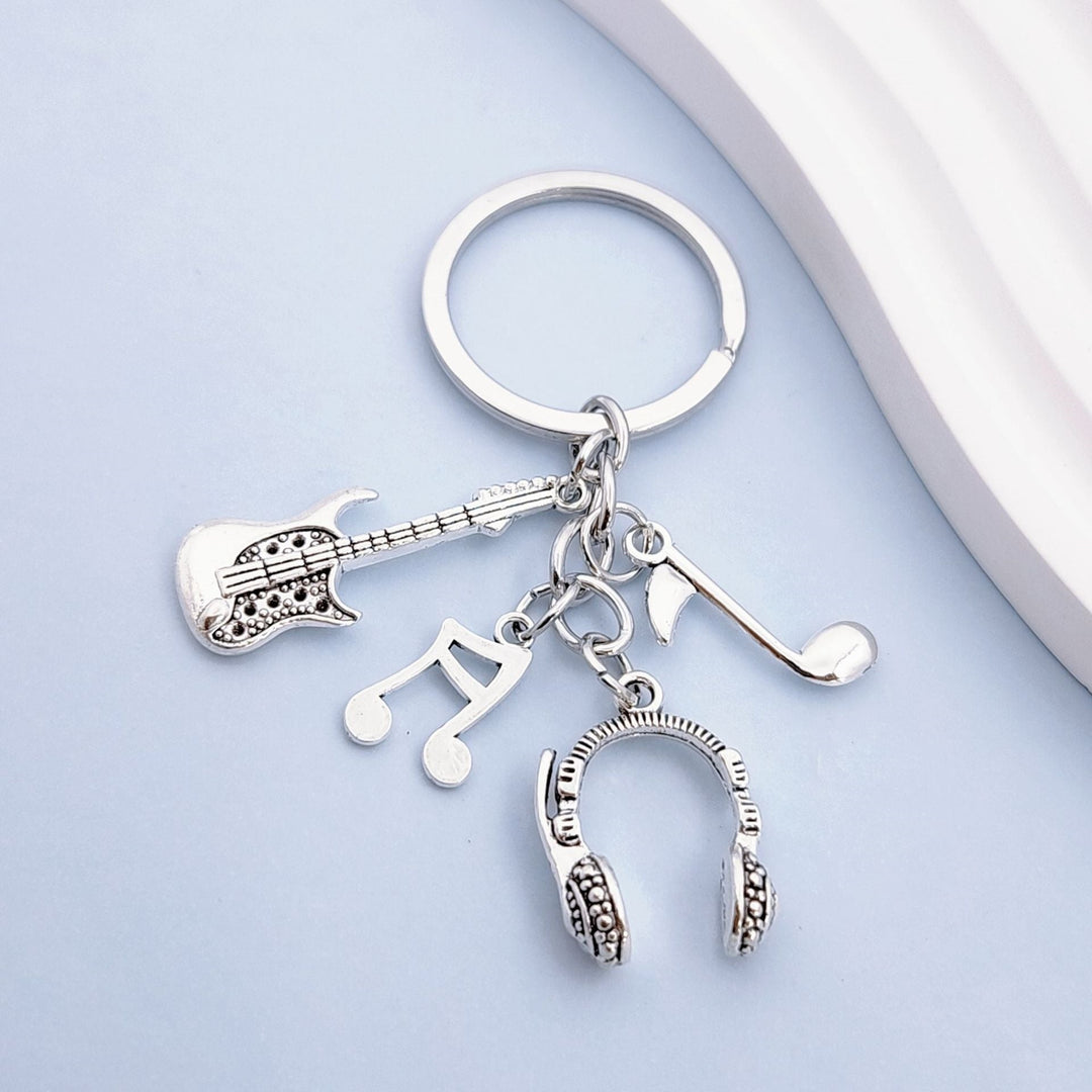 Keychain with musical instruments motifs Kalsten