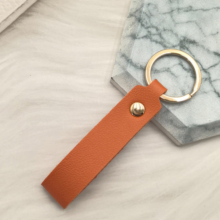 Unisex keychain made of high-quality synthetic leather with elegant metal embellishment Kalsten