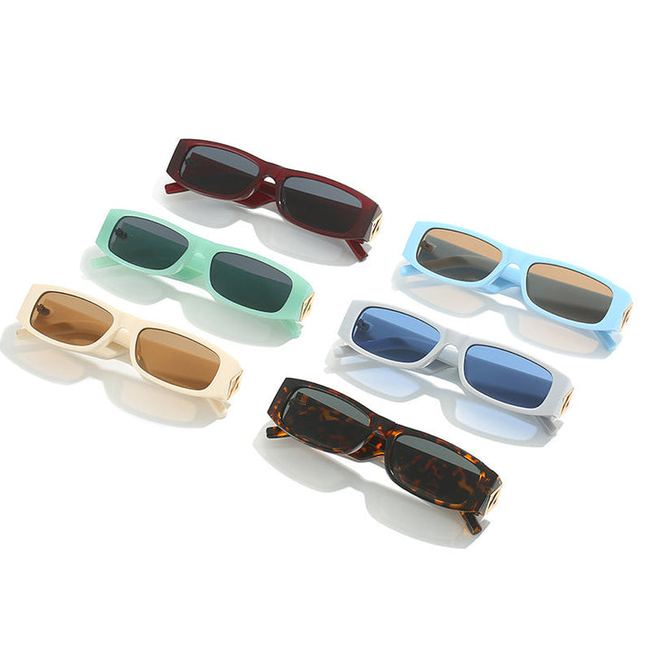 Ladies fashionable sunglasses with asymmetrical frame and gold-colored details Kalsten
