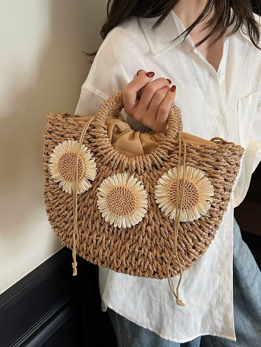 Handbag made of natural material with floral accents Kalsten