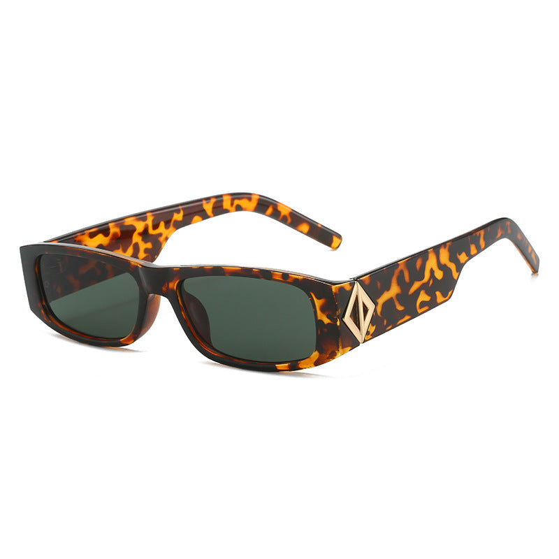 Ladies fashionable sunglasses with asymmetrical frame and gold-colored details Kalsten