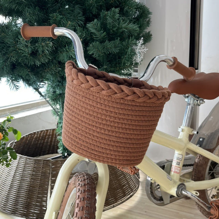 braided rope bike basket with pom pom embellishments and leather handlebar straps Kalsten