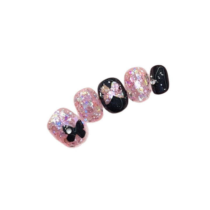 Artificial nails with glitter and bow accents Kalsten