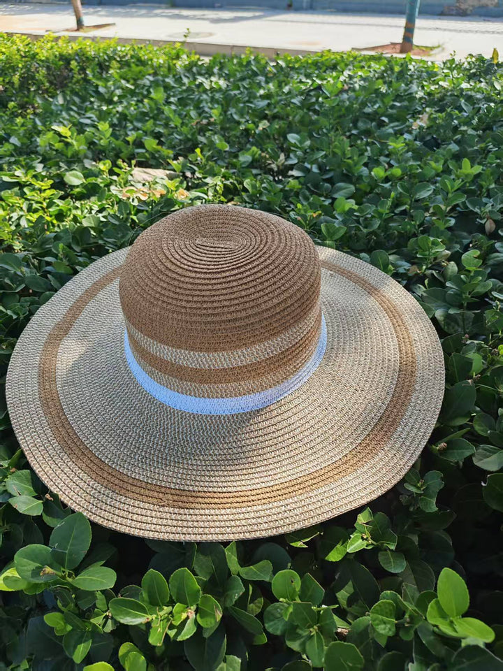 Elegant sun hat with wide brim and subtle stripe pattern Kalsten