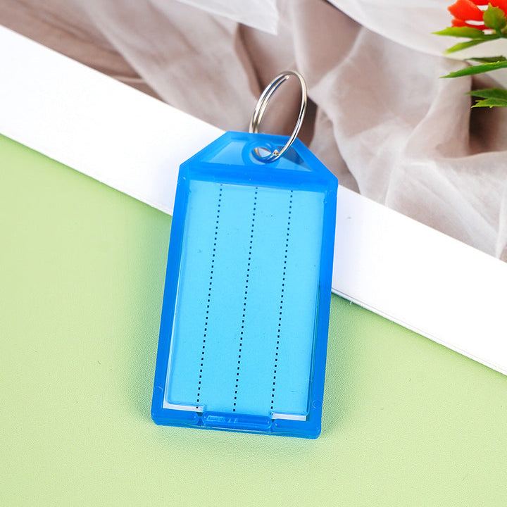 Unisex label tag with transparent sleeve and three writable fields Kalsten