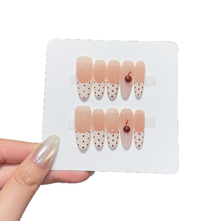 Artificial nails with playful design and cherry accents Kalsten