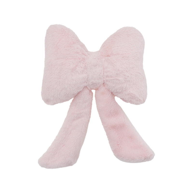 plush bow-shaped decorative throw cushion with long tails and faux-fur texture Kalsten