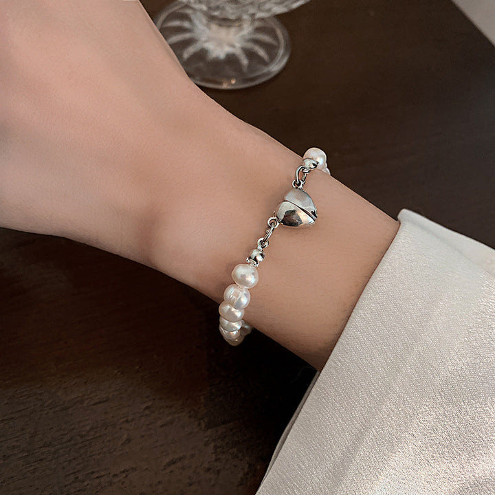 Elegant silver pearl bracelet with heart details Kalsten