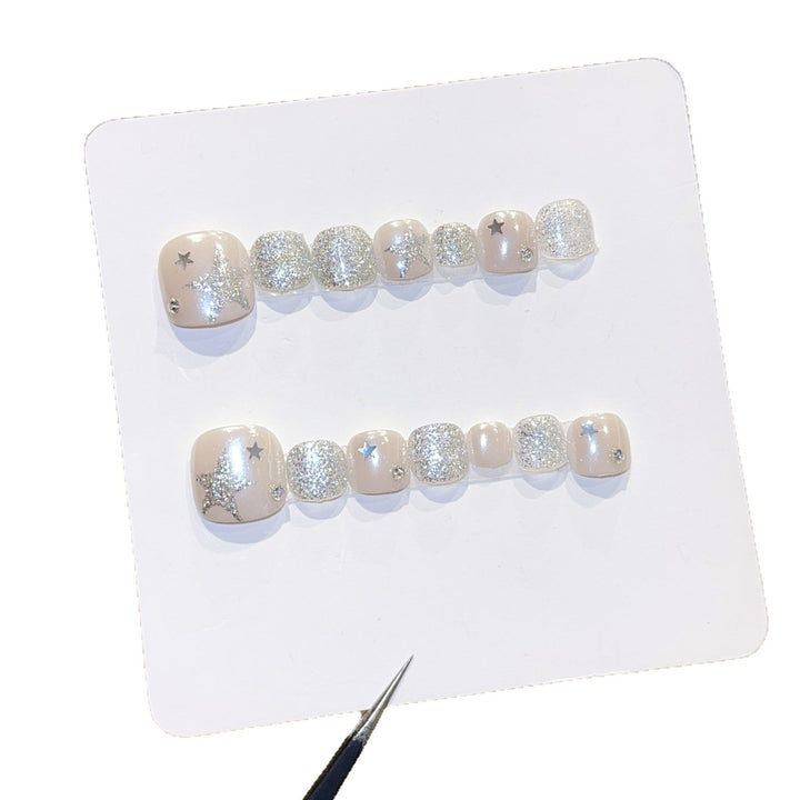 Glamorous artificial nails with sparkling stars and glitter accents Kalsten