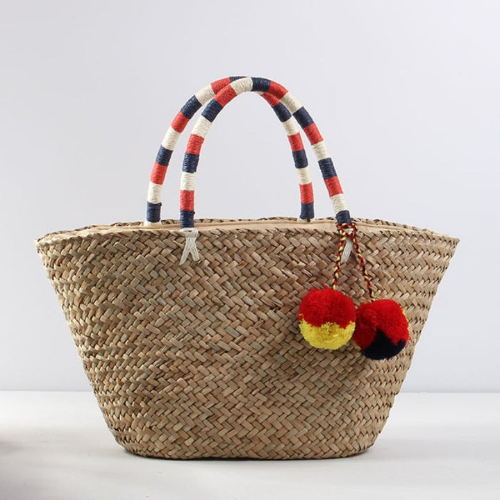 Braided beach bag with decorative pompons Kalsten
