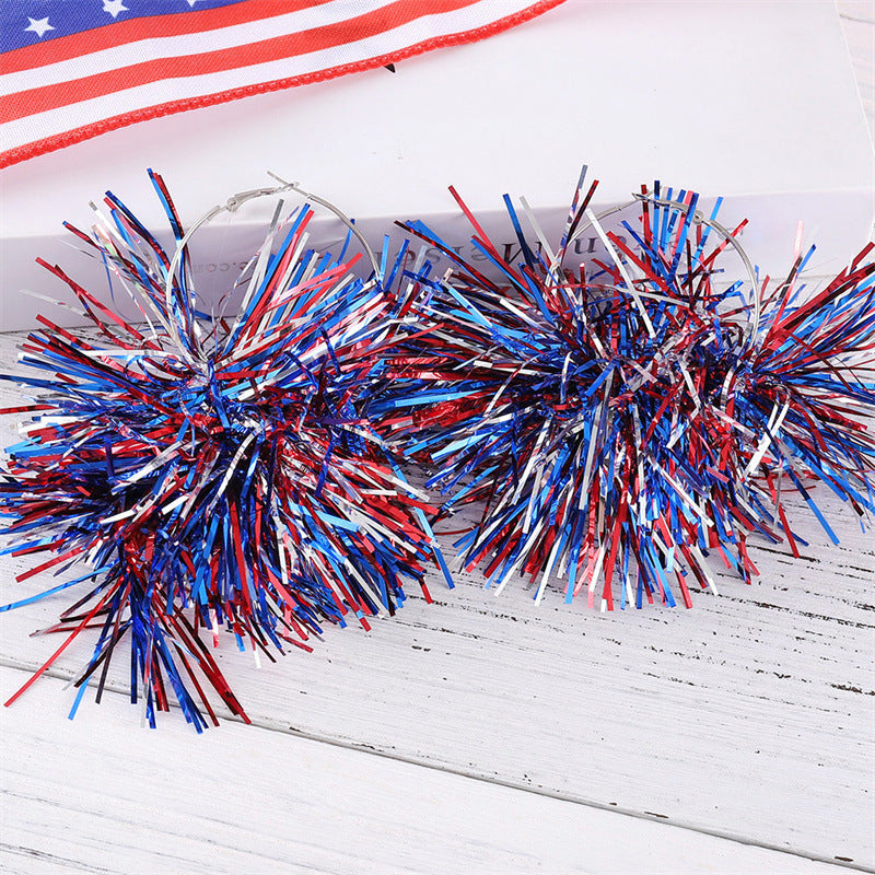 Women with eye-catching pompom hoops with lametta tassels and lightweight wire closure Kalsten