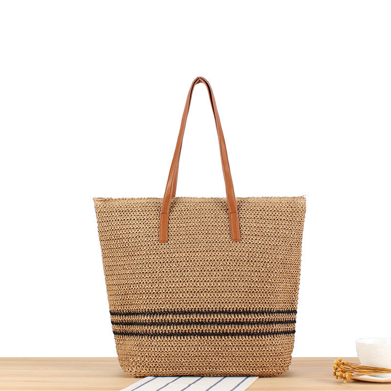 Stylish beach bag made of natural weave with leather handles Kalsten