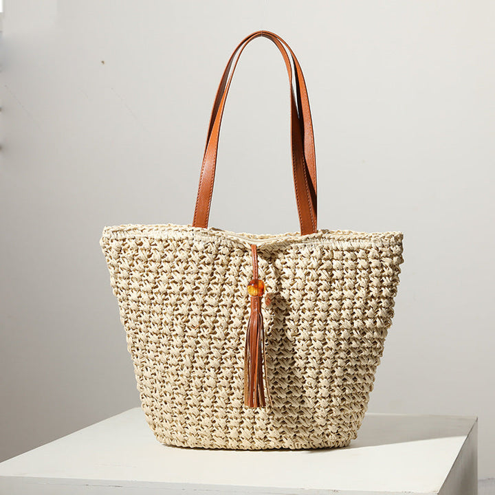 Handcrafted basket bag with fashionable tassel detail Kalsten