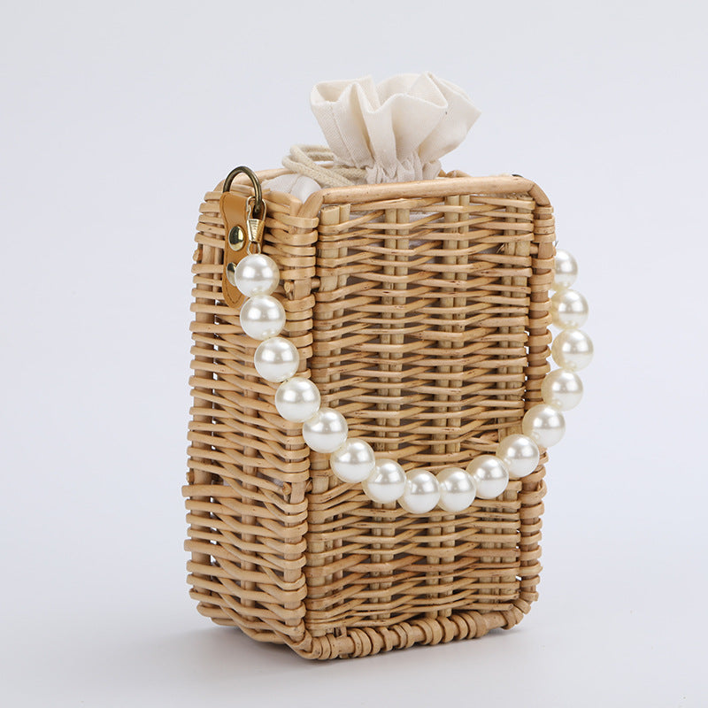Women's handbag made of woven material with pearl accents Kalsten