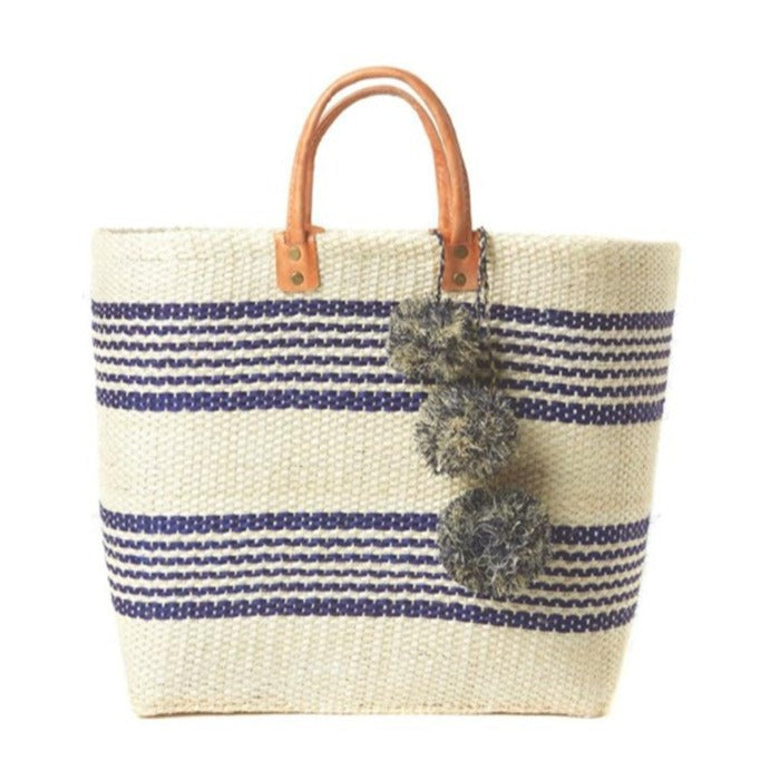 Stylish basket bag with playful pompons Kalsten