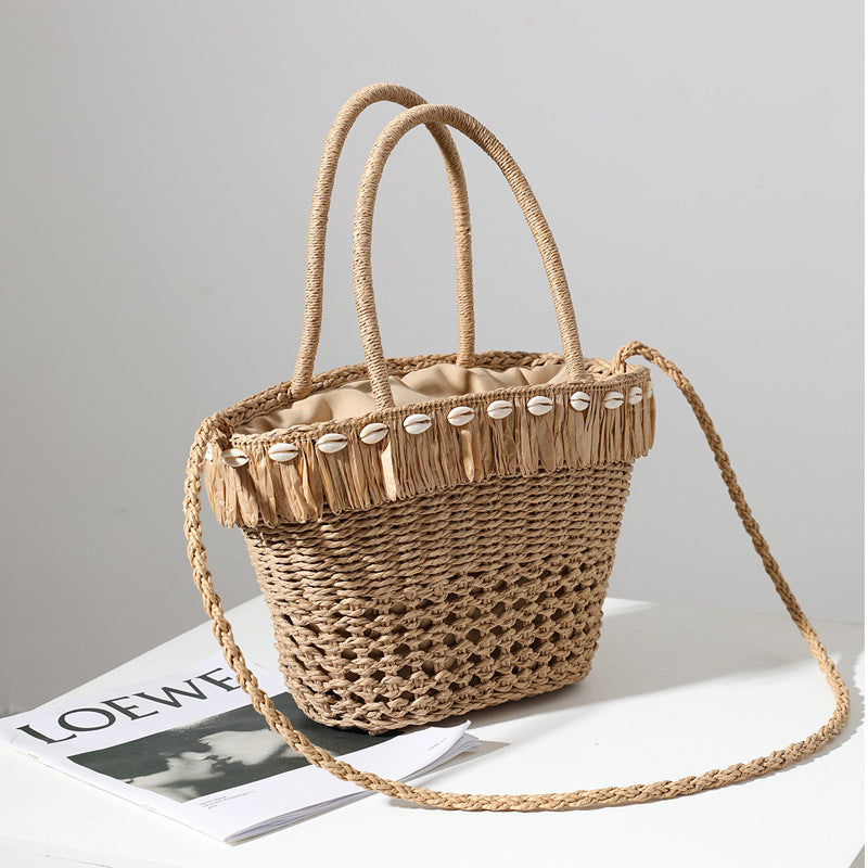 Braided straw bag with decorative tassel detail Kalsten