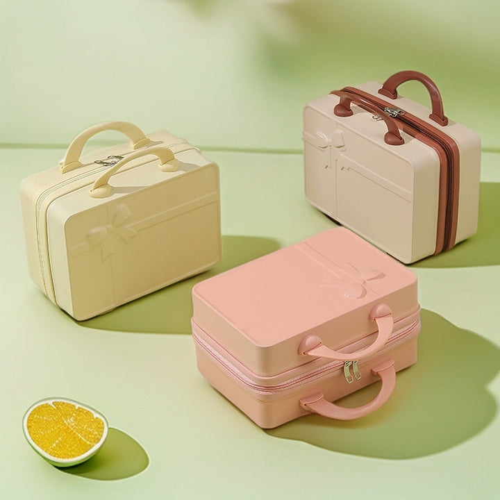 structured hard-shell cosmetic travel case with embossed bow and dual top handles Kalsten