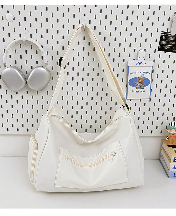 Sporty shoulder bag with spacious interior and sturdy carrying strap Kalsten