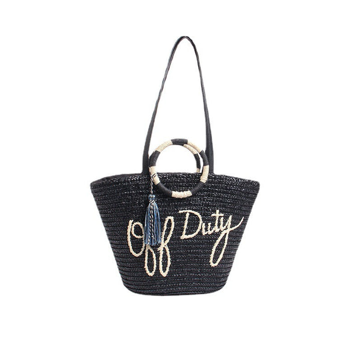 Designer shoulder bag with playful lettering and decorative tassel detail Kalsten