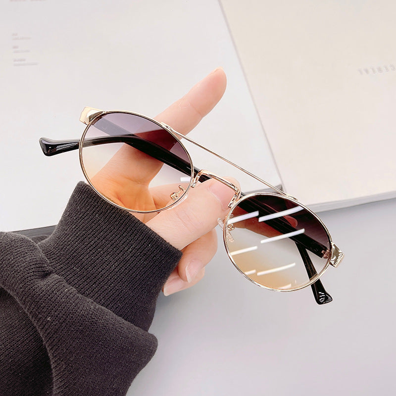 Ladies fashionable sunglasses in stylish round design with golden accents Kalsten