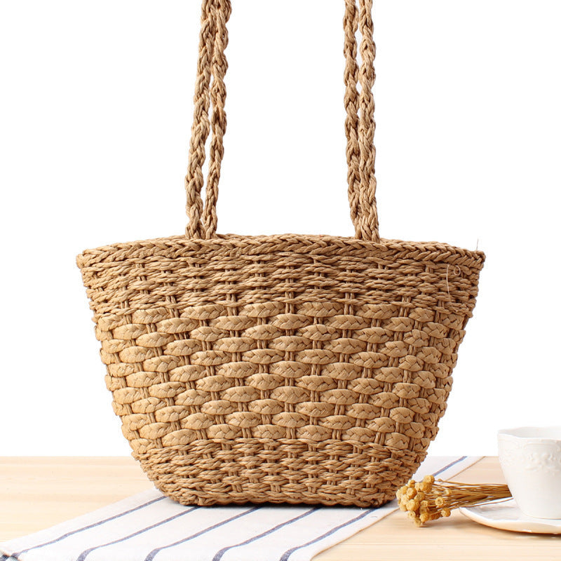 Braided handbag made of natural raffia with robust carrying straps Kalsten