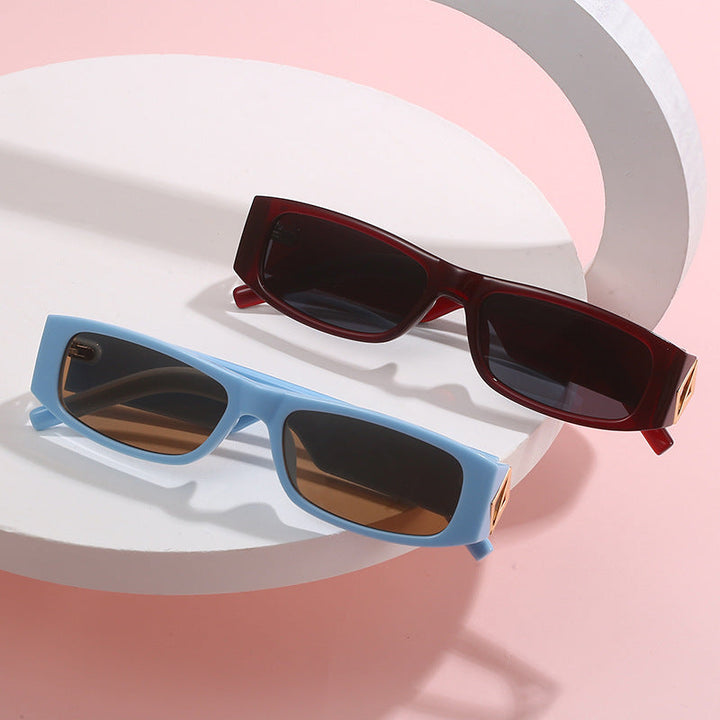 Ladies fashionable sunglasses with asymmetrical frame and gold-colored details Kalsten