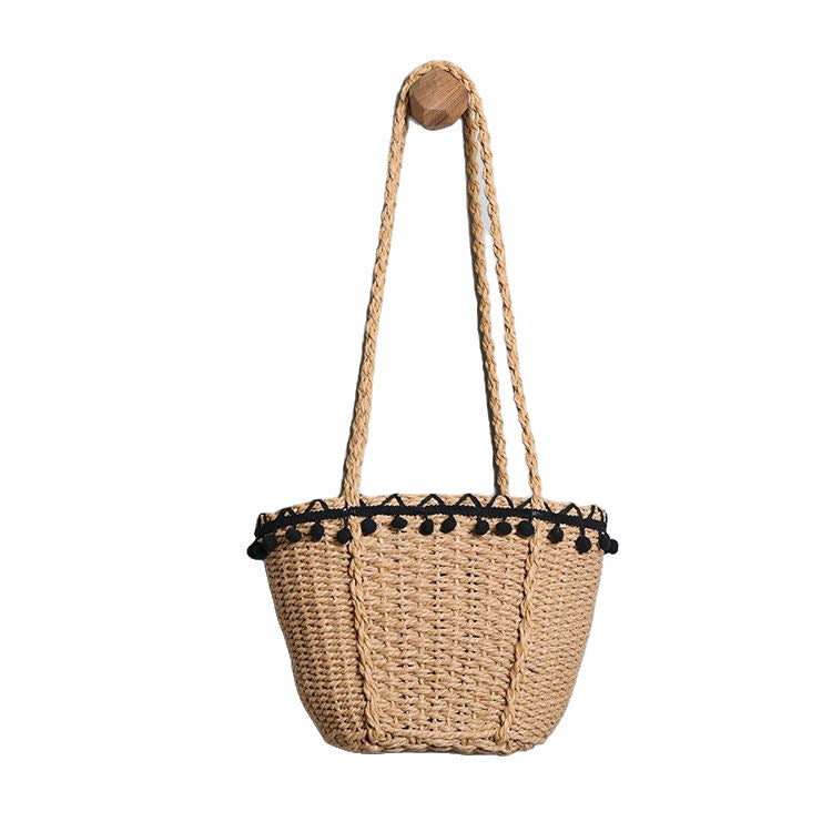 Delicate beach bag with pompons Kalsten