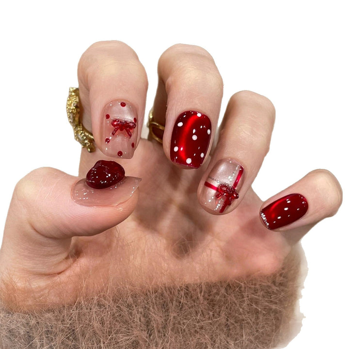Artificial nails with festive gift design Kalsten