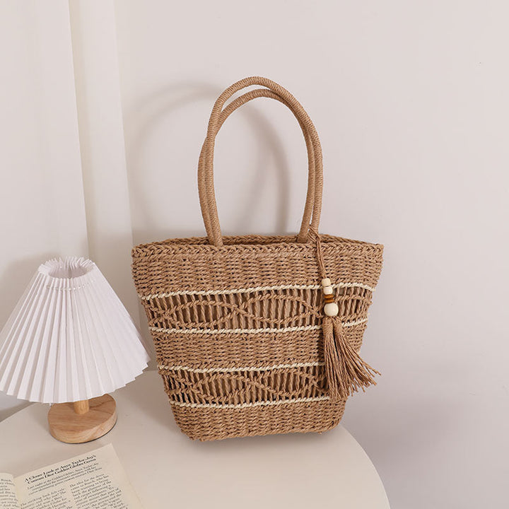 Handcrafted straw tote bag with decorative tassel detail Kalsten