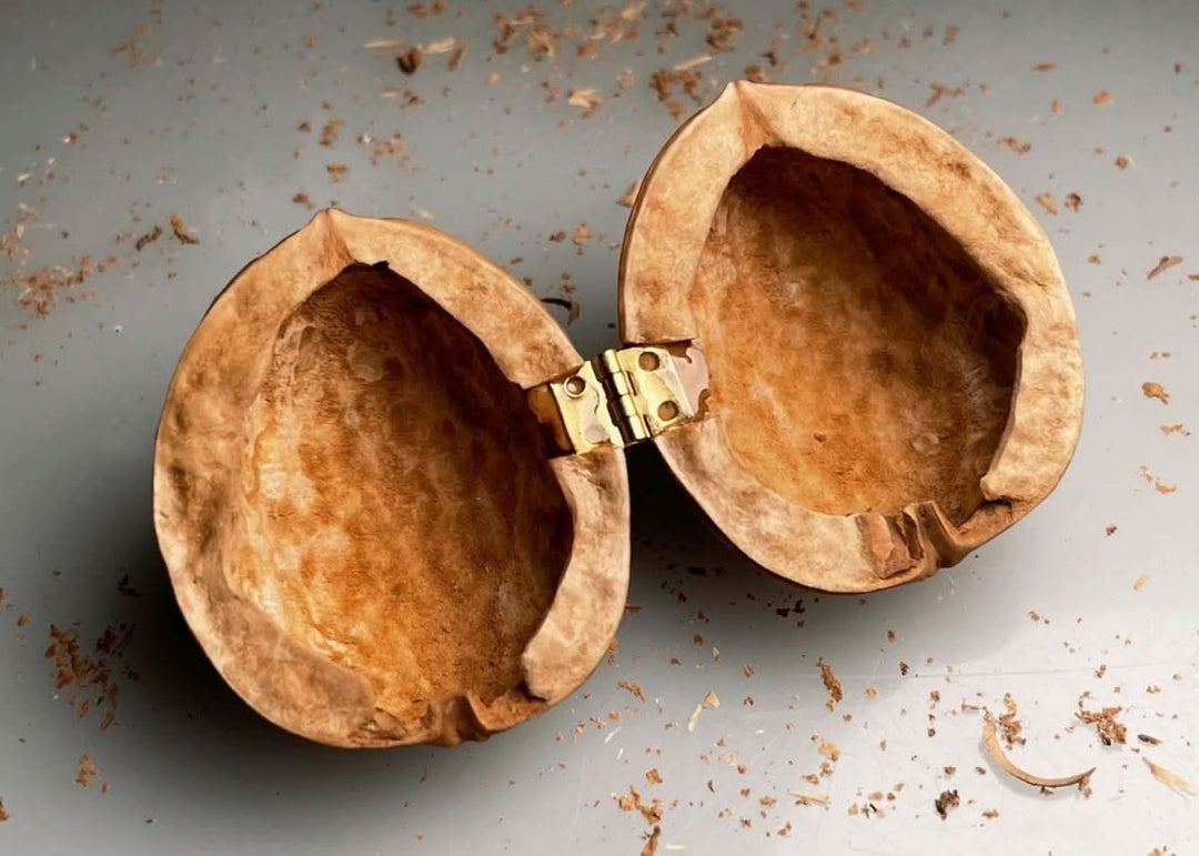 Kalsten | Handcrafted dollhouse made from walnut shells with interior light