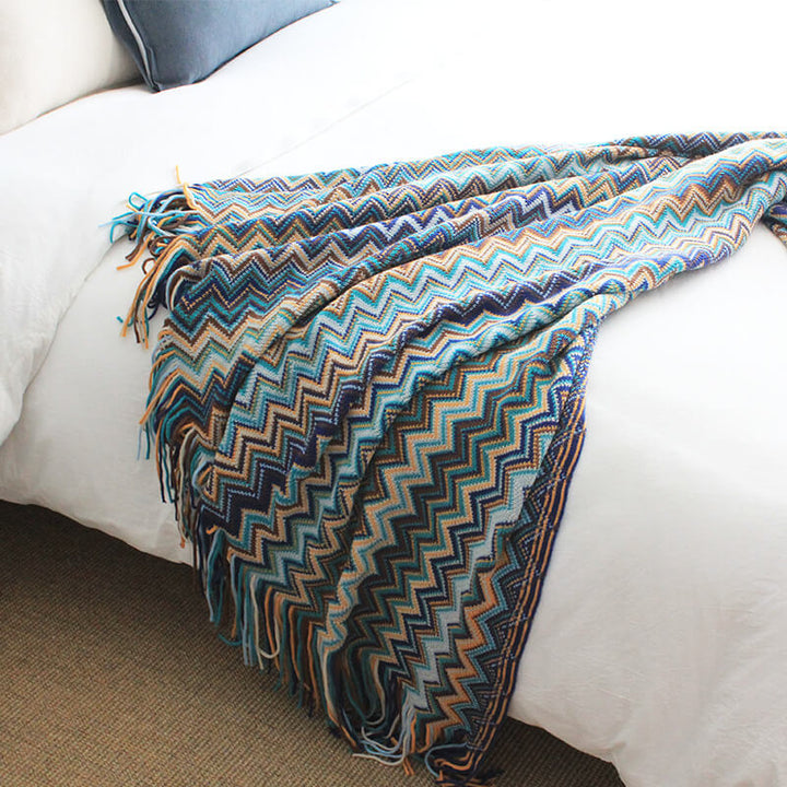 Colorful striped throw blanket with tassels