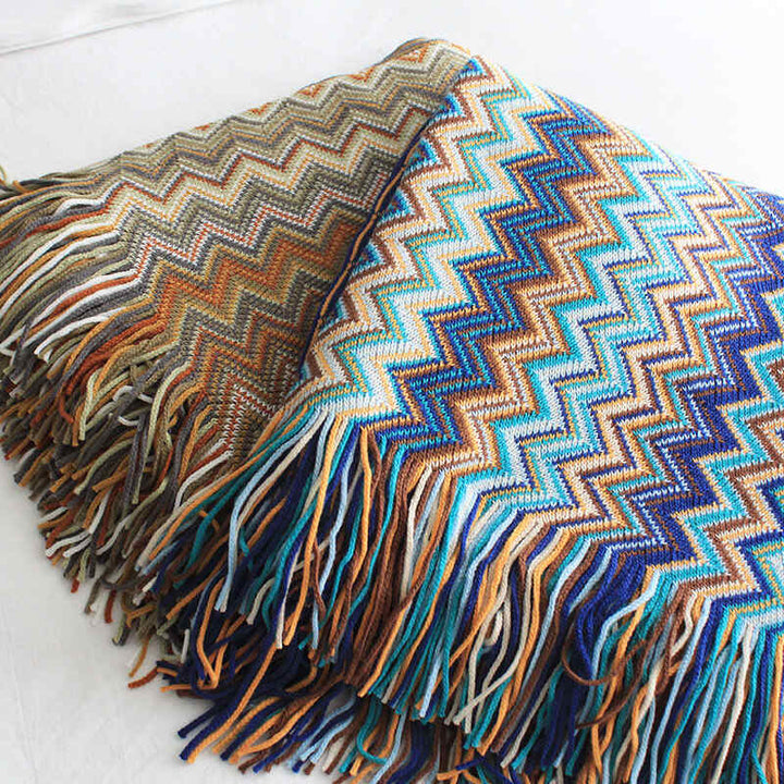 Colorful striped throw blanket with tassels
