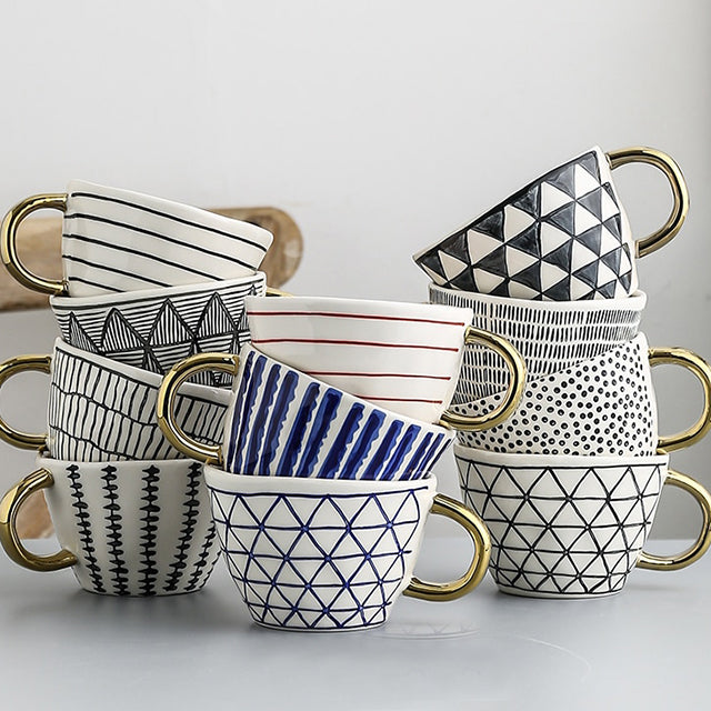 Kalsten | Cup with abstract geometric pattern and gold handle